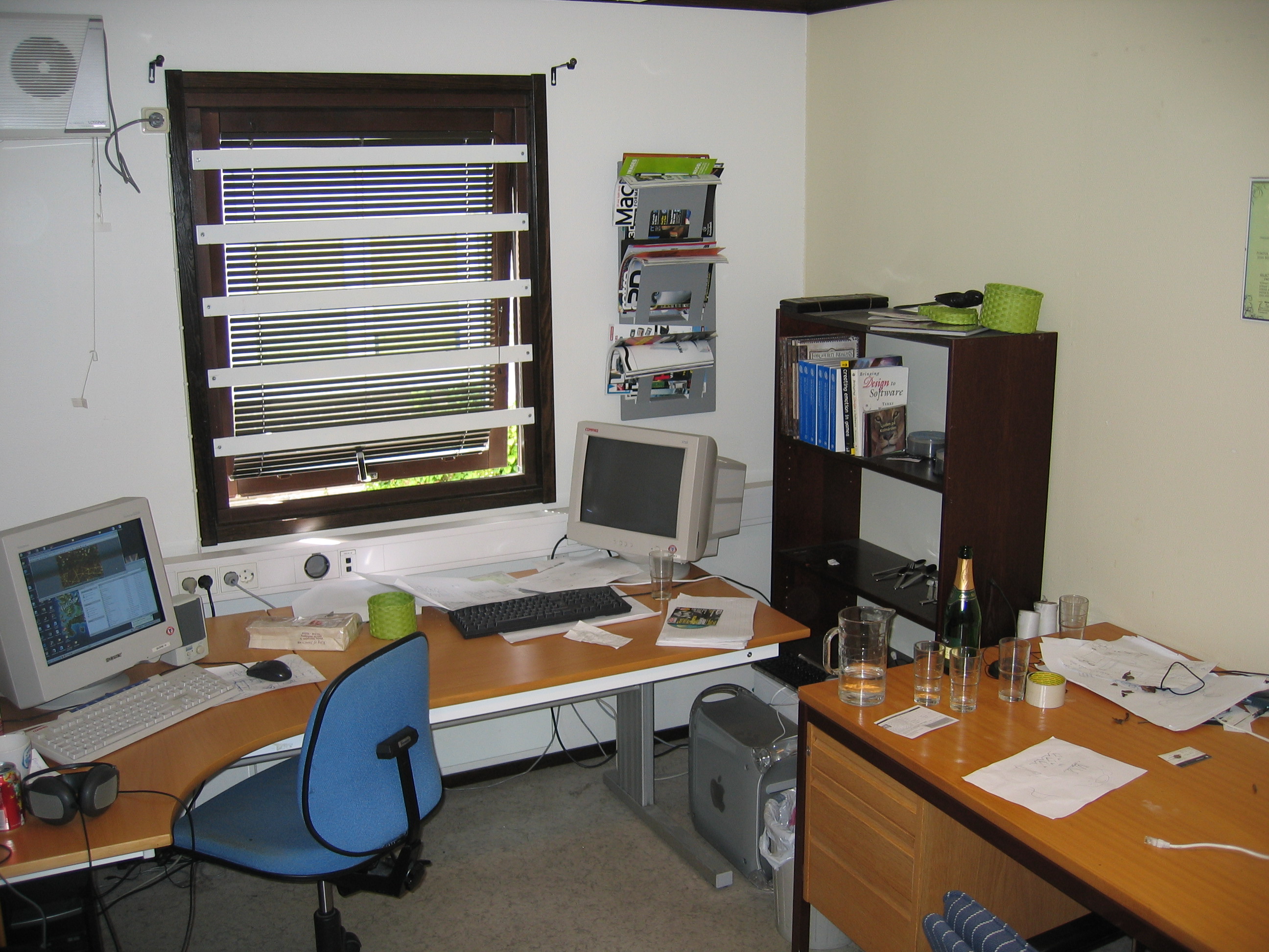 A picture of a standard student office setup in the VentureLab offices, slightly cluttered, but also organised.